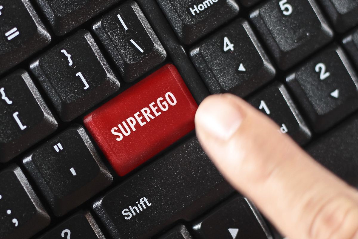 SUPEREGO word on red keyboard button